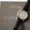 A. Lange & Söhne Lange 1 Zeitzone 950er Platin 116.025 Herrenuhr B&P